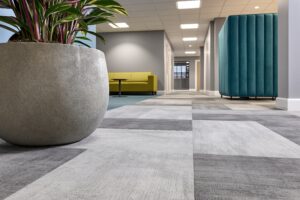 Why does carpet soiling vary across the same building